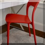 F23. Red desk chair. 